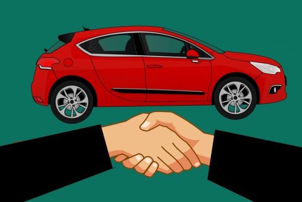 Person holding car keys after arranging car insurance coverage